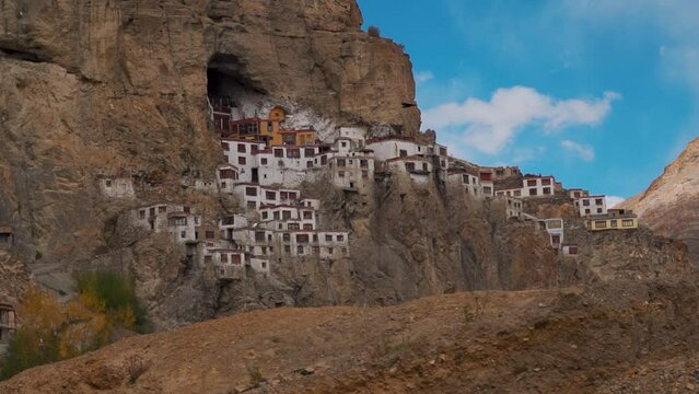 View of the Phugtal monastery built inside the mountain cave during the sunset near Purne in Zanskar Valley, Ladakh, India. Monastery built inside mountains in Zanskar. Remote monastery in India.