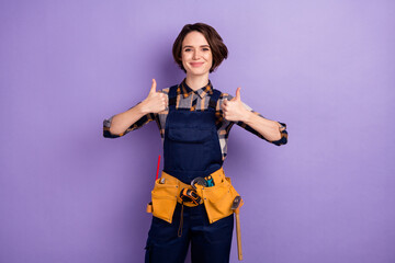 Photo of young woman builder master show thumb-up like cool ad advice choice isolated over purple color background