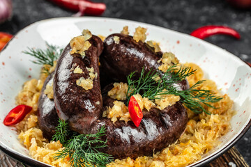 traditional blood sausage with sauerkraut. Food recipe background. Close up