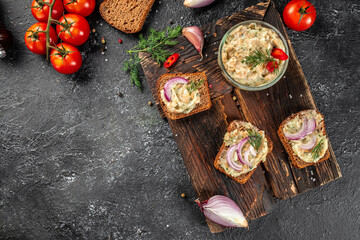 Fresh bread with lard spread on a wooden board. Restaurant menu, dieting, cookbook recipe top view