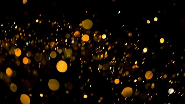 4K Multicolored abstract glitter particles. Shimmering Particles Falling glitter with glare on a bokeh background. Titles in awards, music, wedding, anniversary, party, and presentation backdrops.