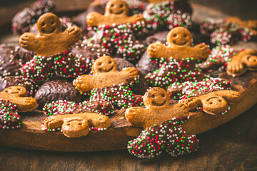 Sweet christmas cookies, gingerbread, on a dark wooden table