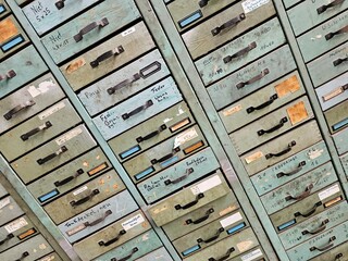 A collection of sturdy, metallic filing cabinets, each adorned with identifiable numbers