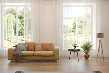 White living room with sofa and summer landscape in window. Scandinavian interior design. 3D illustration