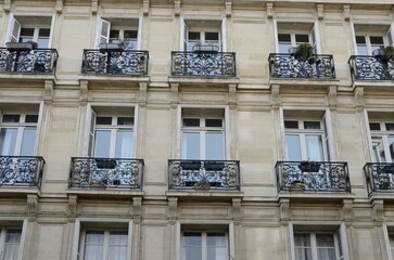 Small balconies on Paris facade - 675456647