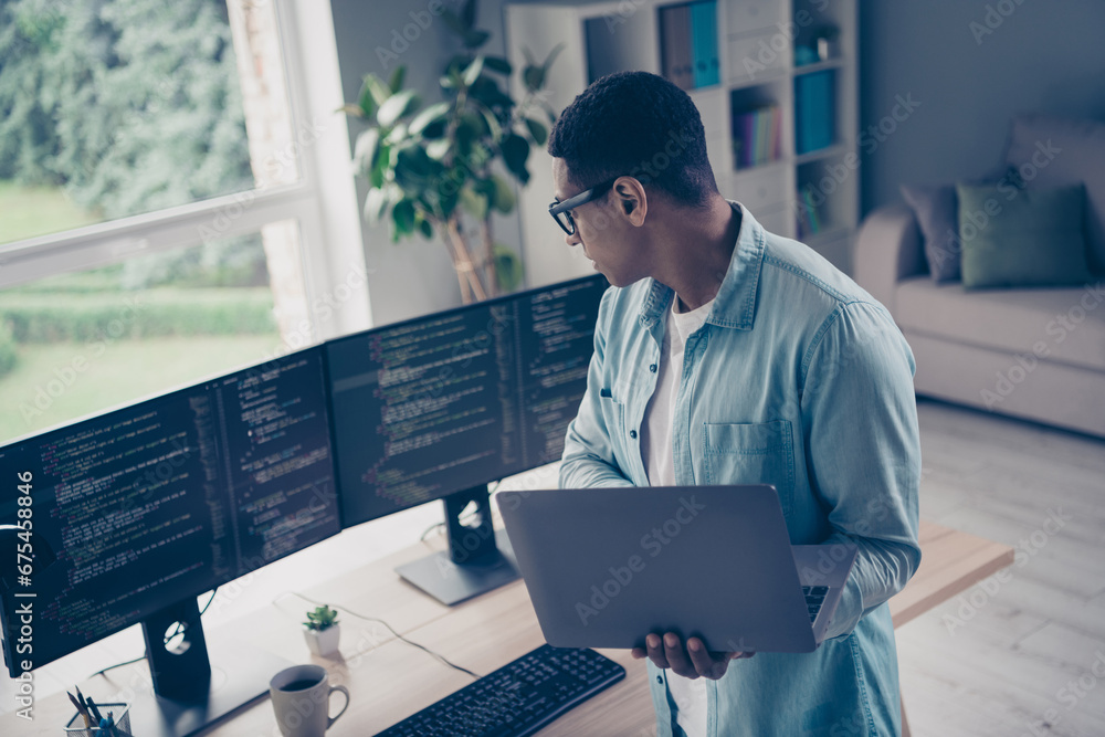 Poster photo of young it specialist system administrator control server working correctly young guy holding
