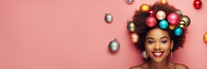 Fototapeta na wymiar Beautiful woman fashion model with creative Christmas balls hairstyle promoting christmas winter seasonal low prices, banner format
