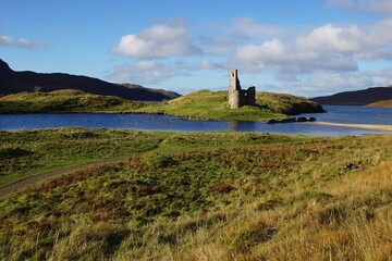 The Ruin of 16th Century Ardvreck Castle sat on a Rocky Promontory in Loch Assynt, Sutherland, Scotland, UK