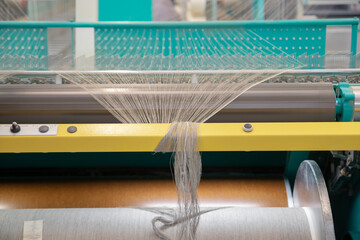 Industrial loom on textile .Flax processing plant, fabric production. Flax is made .A workshop at a...
