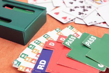 Playing cards and boxes for playing bridge. Gambling, bridge, poker concept. Sport equipment.