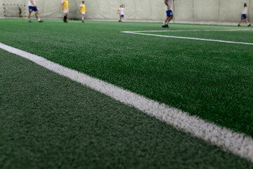 Obraz premium Five-a-side soccer teams during the match on the pitch