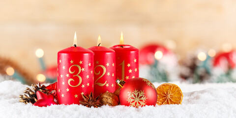 Third 3rd Sunday in advent with burning candle Christmas time decoration panorama with copyspace...