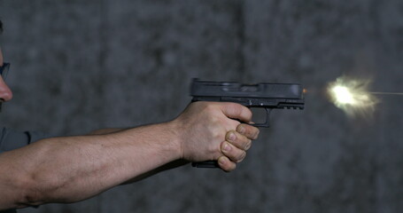 Close-up pistol Stoeger STR-9 Striker Fired 9mm, single shot at shooting range in super slow-motion...