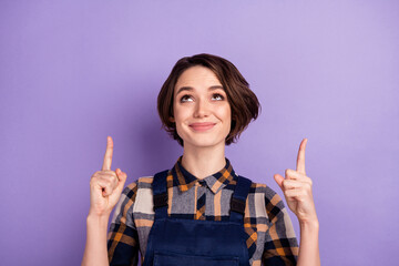 Photo of young woman craftsman happy smile look indicate fingers up advert choose select isolated...