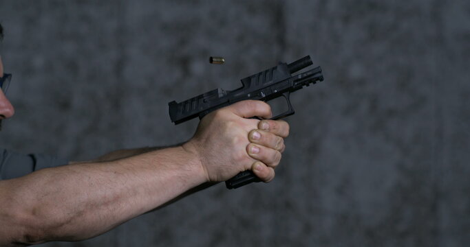 Close-up pistol Stoeger STR-9 Striker Fired 9mm, single shot at shooting range in super slow-motion 800 fps