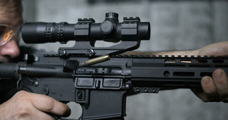 Detail Close-Up of Finger Pulling Trigger on Assault Rifle, Multipel shots in Super Slow-Motion 800 fps - obrazy, fototapety, plakaty