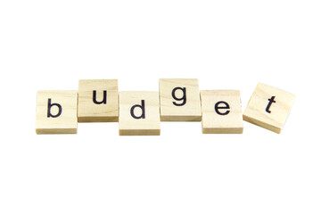 Short word english letter with text "budget" on a small wooden cubes block with bright background.Copy space concept and selection focus.