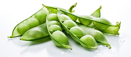 Isolated against the snowy white background the green snap peas packed with healthy vitamins...