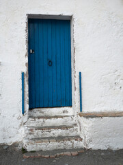 Fototapeta premium Mediterranean house facade with blue door