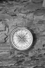 Fototapeta na wymiar black and white photo of round compass