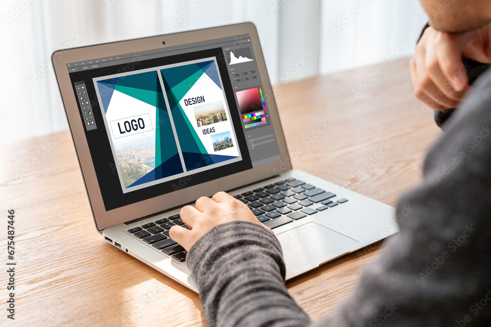 Poster graphic designer software for modern design of web page and commercial ads showing on the computer s