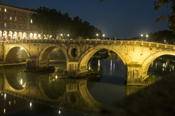 Fototapeta na wymiar The historic Roman bridge Ponte Sisto above the river Tiber at night, Rome, Italy