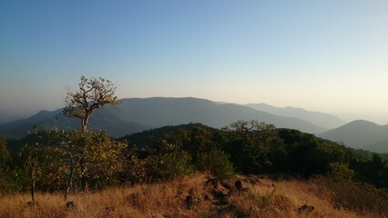 Fototapeta na wymiar Sunset on a mountain's view point in India. Maharashtra State. Wildlife.