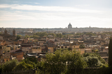 Fototapeta na wymiar Panorama of Rome with St. Peter's Basilica as seen from the viewpoint 'Terrazza Viale del Belvedere'