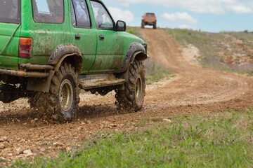 offroad car driving on track in dirt. adventure offroad racing