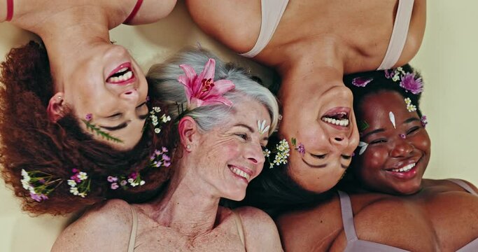 Diversity, face flowers or women laugh with self love, natural facial beauty and solidarity on studio background. Woman empowerment group, sustainable creative design or funny floral friends on floor