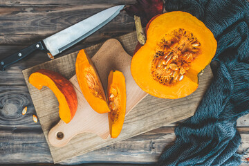Autumn pumpkins and leaves on a wooden table.Autumn pumpkin thanksgiving background with...
