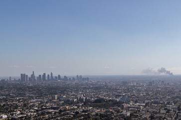 view of los angeles from the griffith observatory, image shows a cityscape view with a warehouse...