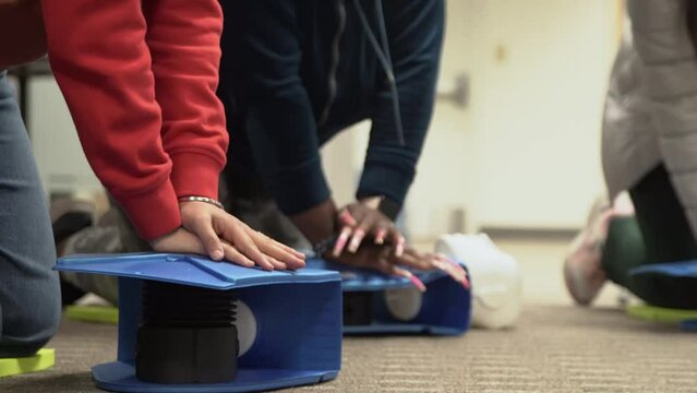 Emergency and Standard First aid and CPR training class by security guard in office