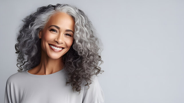 Beautiful Black Woman With Smooth Healthy Face Skin. Gorgeous Aging Mature Woman With Long Gray Hair And Happy Smiling. Beauty And Cosmetics Skincare Advertising Concept