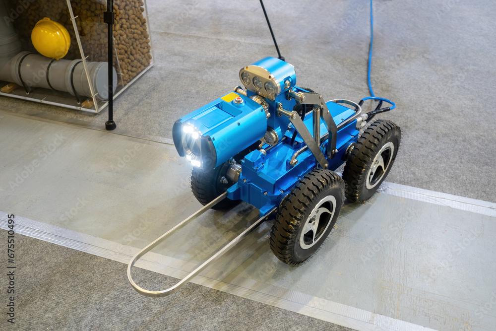 Poster robot pipeline inspector. machine for checking pipe from inside. autonomous robot with camera and fl