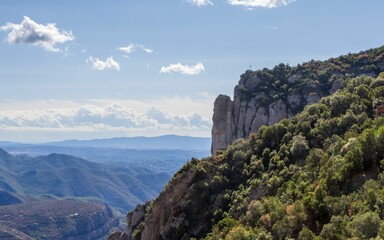 Fototapeta na wymiar Scenic view of St Michael's Cross at Montserrat mountains in Spain