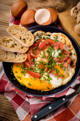 Homemade breakfast fried egg with tomato.