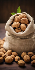 Walnuts in burlap sack on wooden surface. Sack full of nuts prepared for easy snack bag. Consuming local commerce in small businesses and cooperatives that produce organic foods.