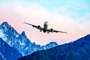 passenger plane flies over the mountains. air transport industry