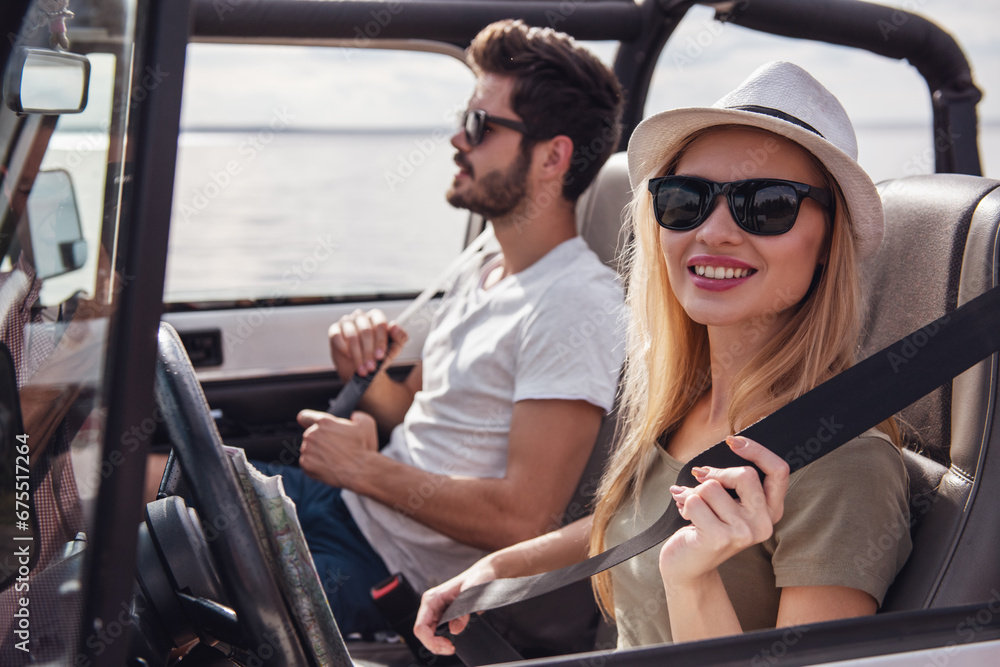 Poster couple travelling by car