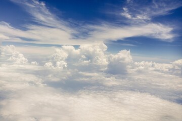 Fototapeta premium Aerial view of a clear sky with scattered clouds