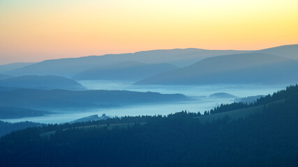 Morning fog in a mountain valley area