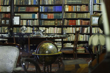 Classic style studio with old library and globe