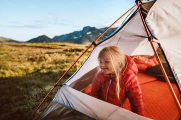 Child traveling with camping tent gear active family vacations kid hiking outdoor healthy lifestyle adventure trip exploring mountains of Norway - obrazy, fototapety, plakaty