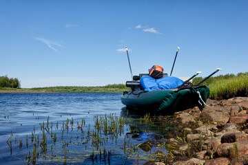 Inflatable raft full gear and paddles by Lainio river in Lapland in Sweden in August 2021. - obrazy, fototapety, plakaty