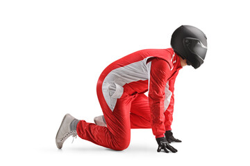 Full length profile shot of a car racer with a helmet starting a running race