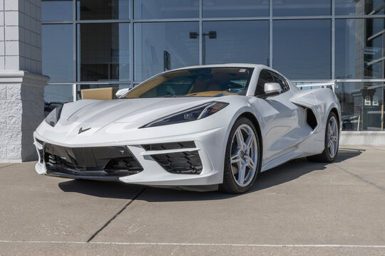 Chevrolet C8 Corvette display at a dealership. Chevy offers the Corvette in 1LT, 2LT, 3LT, and Z06 models.