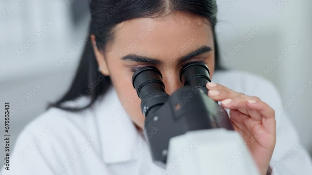 Poster scientist looks in a handheld microscope to examine monkeypox sample in a research laboratory. bioch