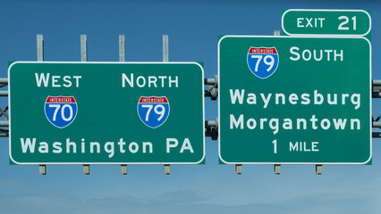 signs for Exit 21 on Interstate70 for Interstate 79 South toward Waynesburg and Morgantown, and continuing on I70 West and I79 North - obrazy, fototapety, plakaty