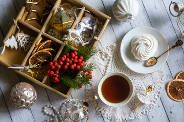 A cup of tea, New Year's toys, a calendar for the New Year 2024. Still life in vintage style.